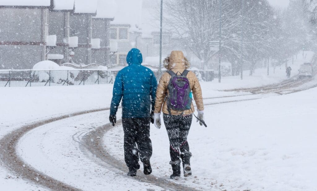 Winter preparation and people walking in the snow